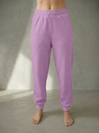 Deryn Luxury Jogger Sorbet colour worn by a person on a neutral backgroundy